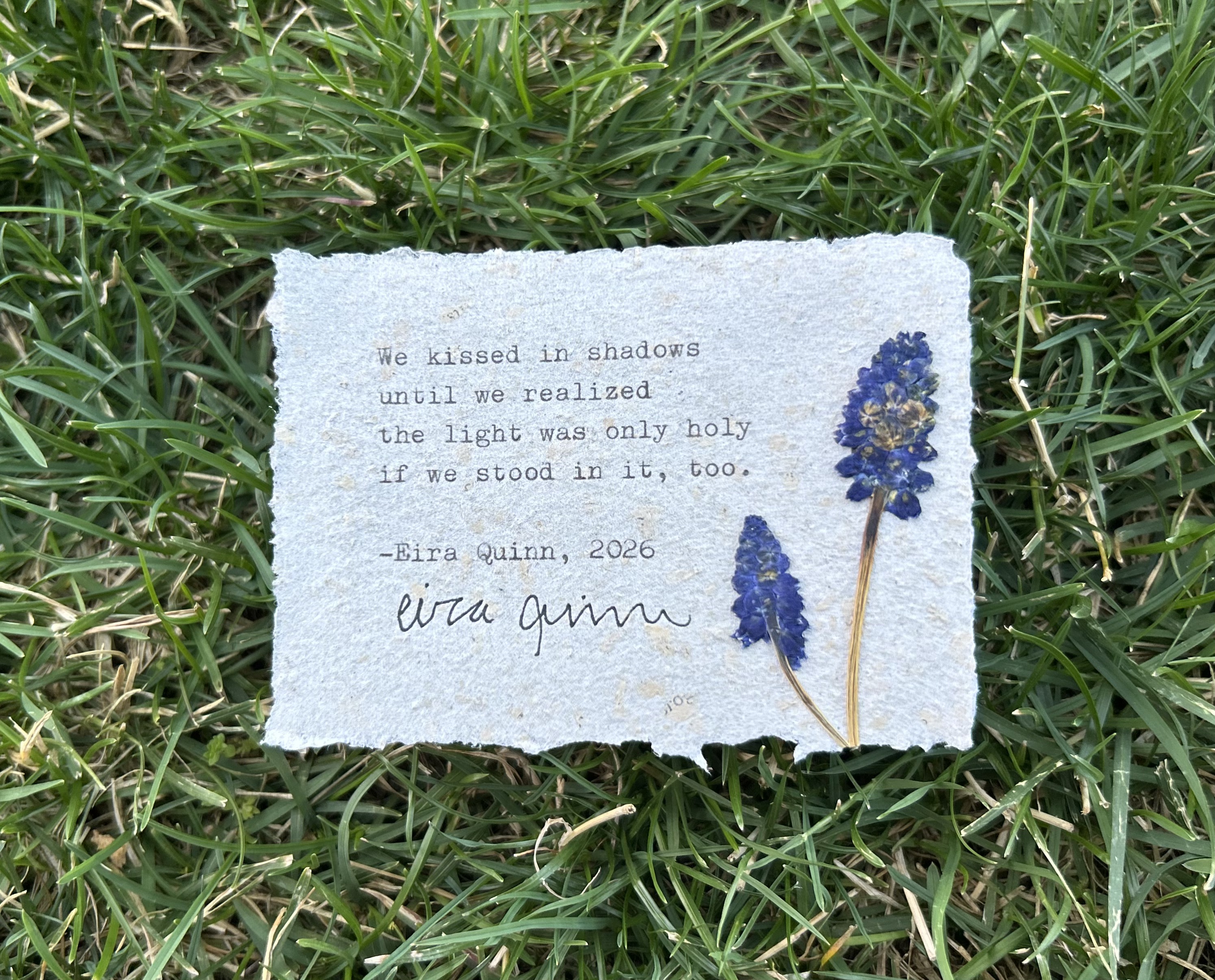 We Loved Anyway typed on handmade paper with pressed flower